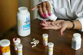 A South African doctor and activist working in a rural clinic, providing care and education about HIV prevention and treatment, symbolizing the fight against apartheid-era healthcare inequalities and the ongoing battle against the HIV/AIDS epidemic.