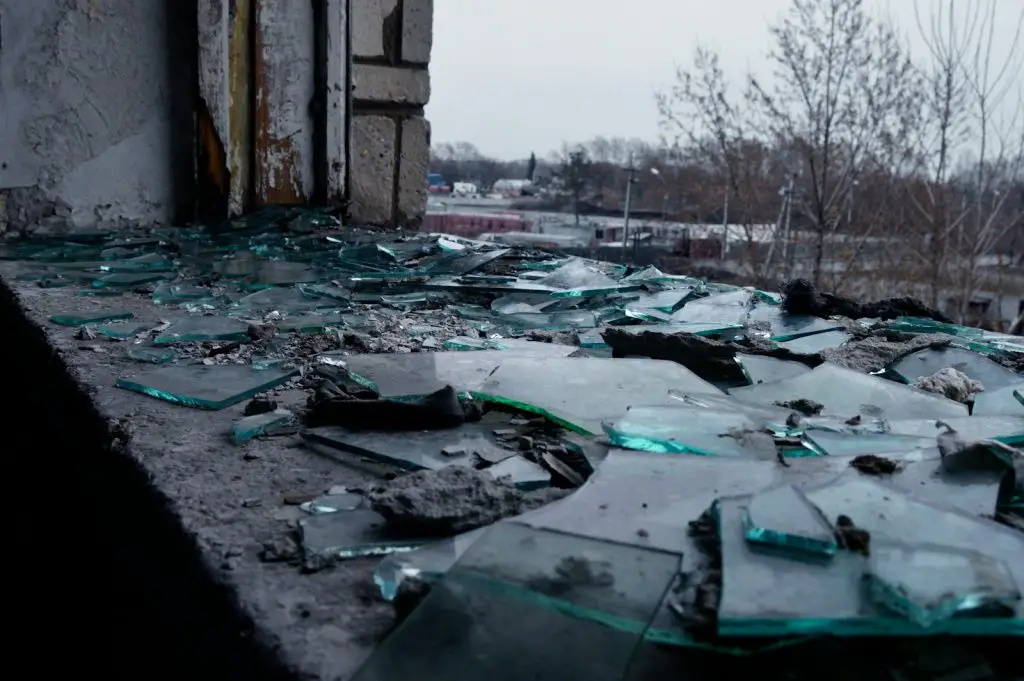 Russia attack aftermath in Kyiv with damaged buildings and emergency response teams