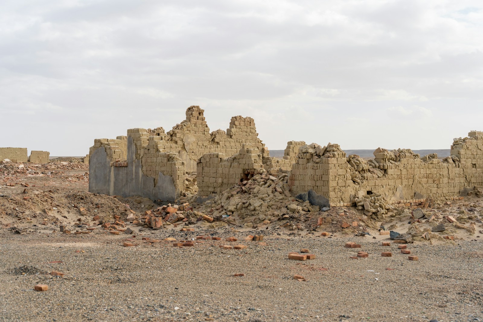 Sudan War Crimes aftermath in Darfur showing destroyed homes and displaced families